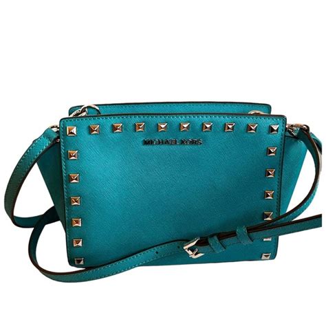 michael kors selma stud medium messenger tile blue